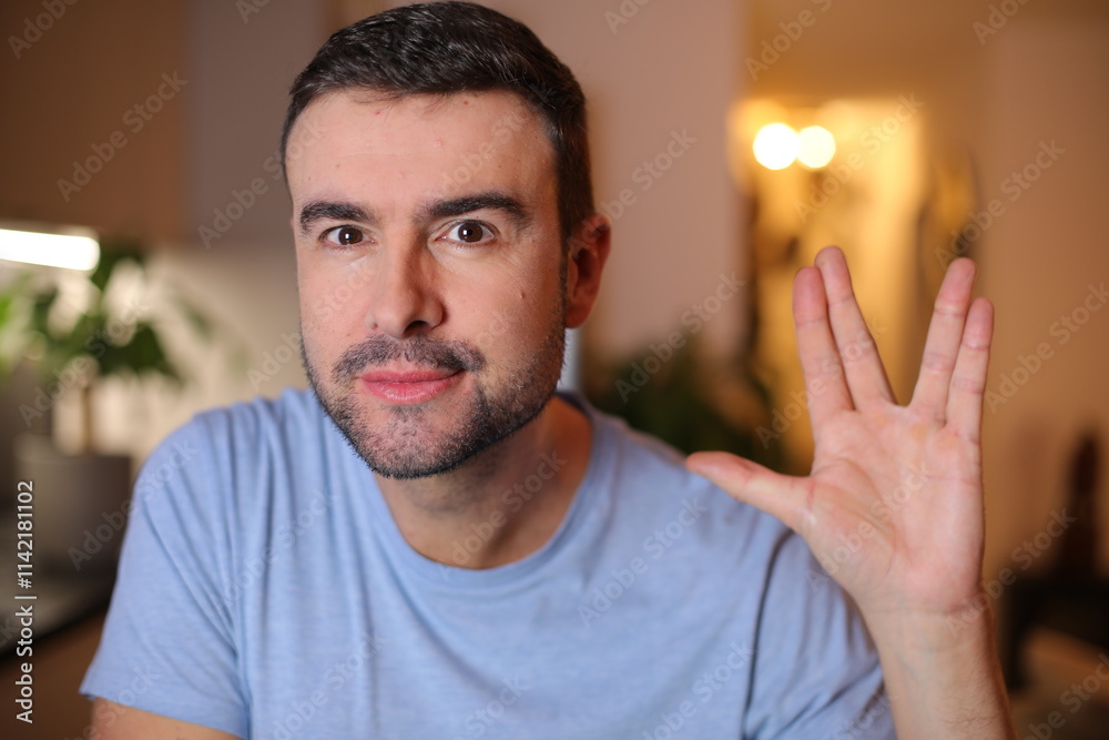 Φωτογραφία Man doing the fictional Vulcan Salute to live long and prosper