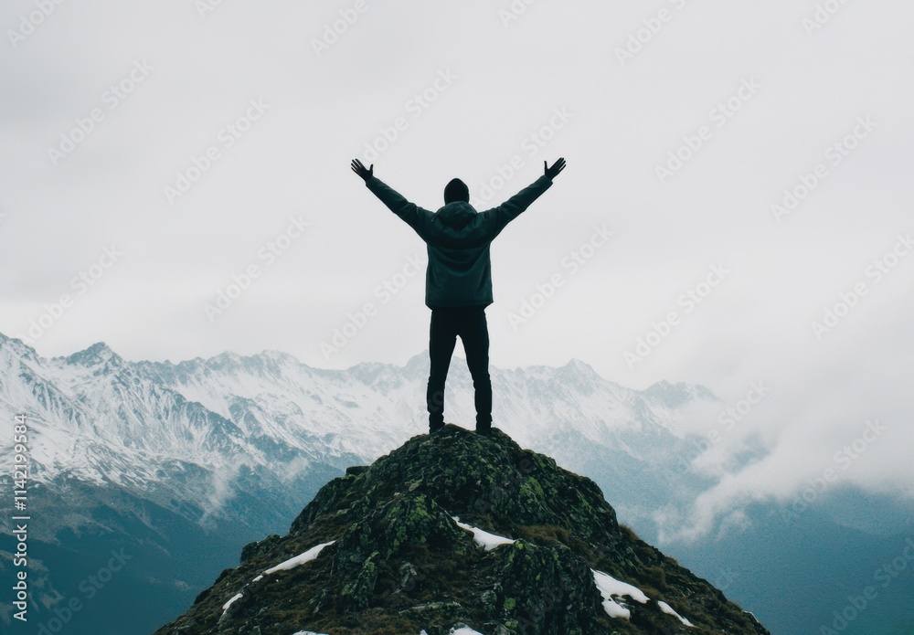 Person Standing on Mountain Peak with Outstretched Arms in Nature Person Standing on Mountain Peak with Outstretched Arms in Nature