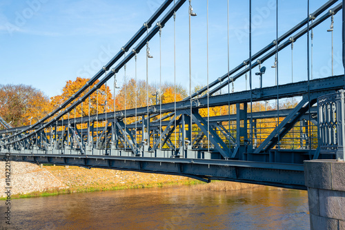 Span of the old chain bridge. Ostrov city, Russia