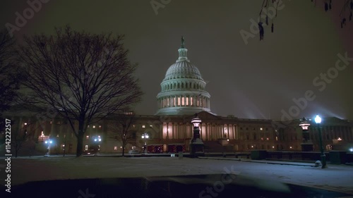 Capitol building at winter in snow. Capitol democracy in USA Washington DC, Capitol building USA. Washington monument. USA Congress. Capitol is symbolic of USA. Night winter in Washington D C.