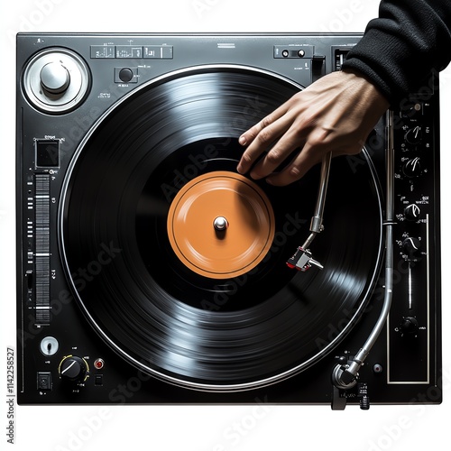 Hand spinning a vinyl record on a turntable, black isolate background. photo