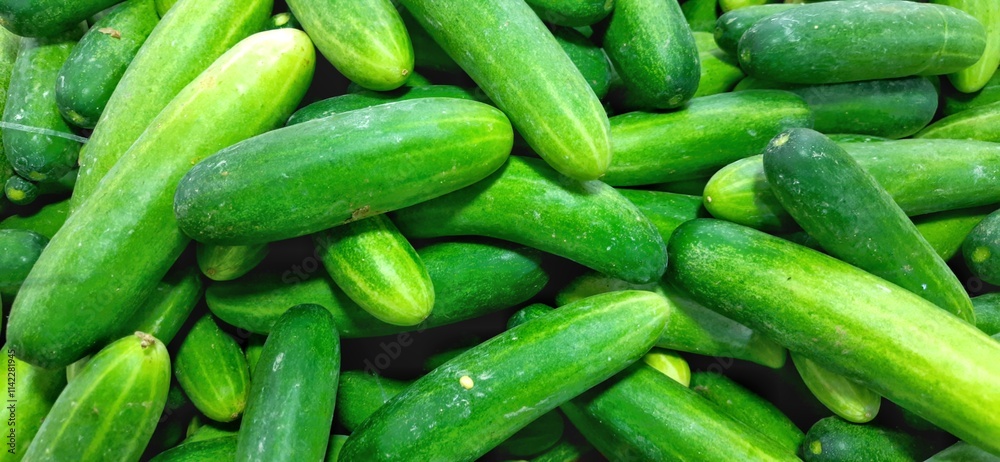 Fresh green cucumbers fruit or timun background for sale at traditional market Fresh green cucumbers fruit or timun background for sale at traditional market