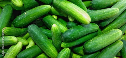 Fresh green cucumbers fruit or timun background for sale at traditional market