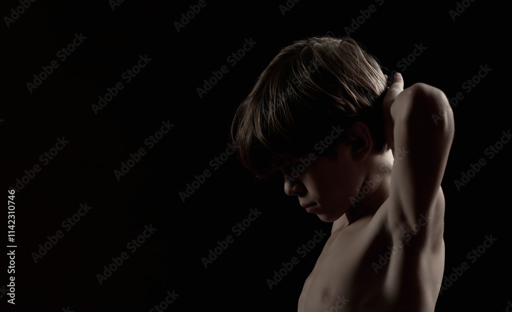 Portrait of a little boy on a dark background Portrait of a little boy on a dark background