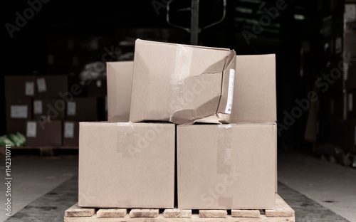The packing box on the pallet with the goods is torn