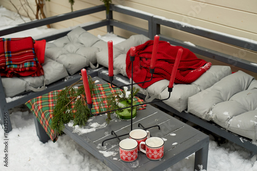 New Year's street d cor. Green wreaths, red pillows and blankets. Snow. photo