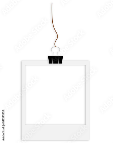 blank polaroid photo frame hanging from a string