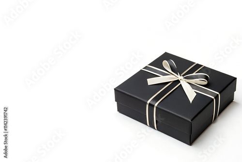 Black Gift Box with Cream-Colored Ribbon Placed Right Side Isolated on White Background and copy space