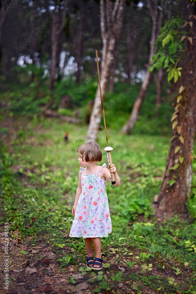 Kid girl plays in the woods Kid girl plays in the woods