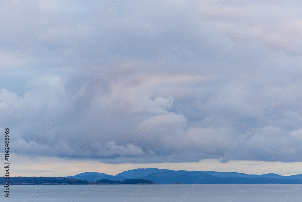 Scenic View of Vancouver Island's Sky at Sunrise Over Calm Waters Scenic View of Vancouver Island's Sky at Sunrise Over Calm Waters