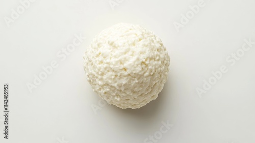 Single extruded puffed cheese ball isolated on white from above. photo