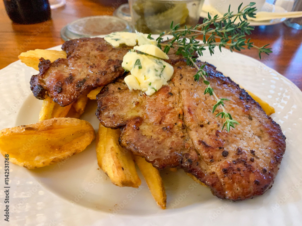 Roasted pork steaks from neck meat. Roasted pork steaks from neck meat.