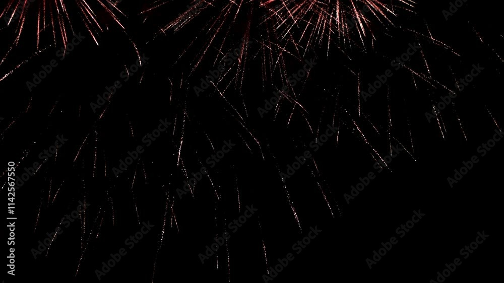 Bright colorful festive glowing fireworks on night sky.  New Year, Christmas, festival, party and holiday celebration concept