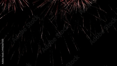 Bright colorful festive glowing fireworks on night sky.  New Year, Christmas, festival, party and holiday celebration concept