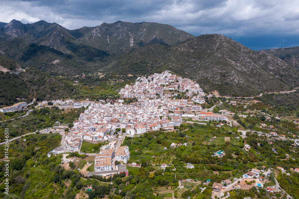 Obraz premium Aerial drone view of typically white Spanish village OJEN. Situated close Marbella city, in the mountains at 200 m altitude. Is a famous travel destination. 