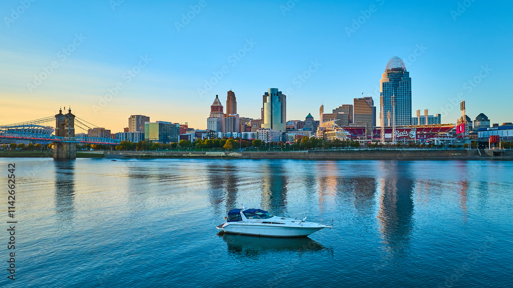 Fototapeta premium Cincinnati Skyline at Golden Hour with Riverboat Aerial
