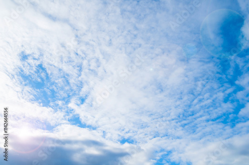 Blue sky and clouds, sweeping vast blue sky background with cumulus clouds in early morning