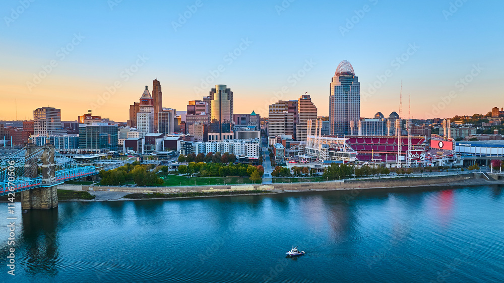 Fototapeta premium Aerial of Cincinnati Skyline at Golden Hour with Roebling Bridge