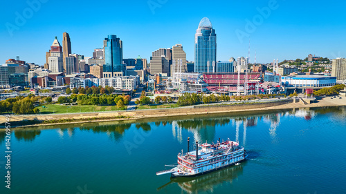 Aerial of Cincinnati Skyline and paddle wheel Riverboat on Ohio River photo