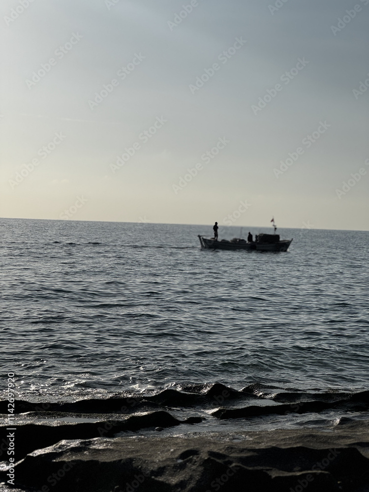 silhouette of a ship at sea sunset. High quality photo silhouette of a ship at sea sunset. High quality photo