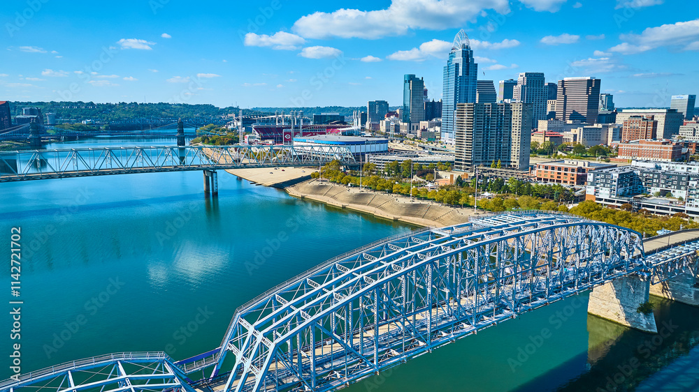 Fototapeta premium Aerial of Cincinnati Skyline with Ohio River and Steel Bridge
