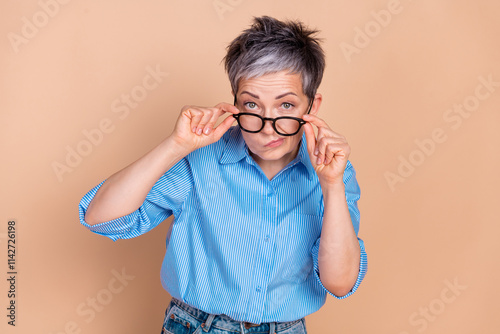 Photo portrait of gray hair retired experienced business lady dissatisfied take off glasses suspicious isolated on beige color background