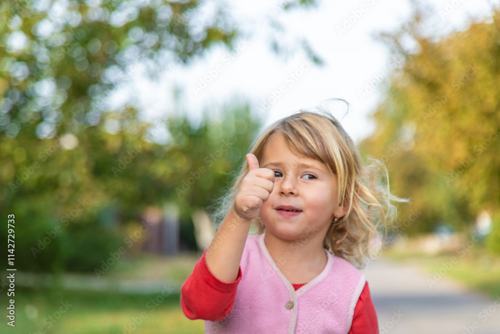 Child shows finger class. Selective focus. Child shows finger class. Selective focus.