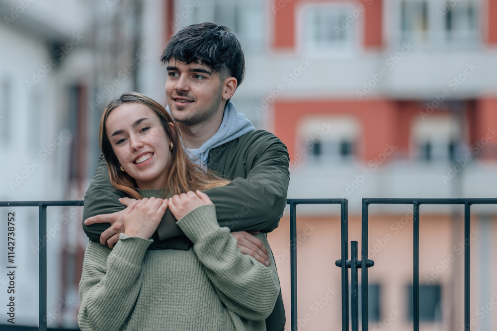 young couple in love hugging on the street young couple in love hugging on the street