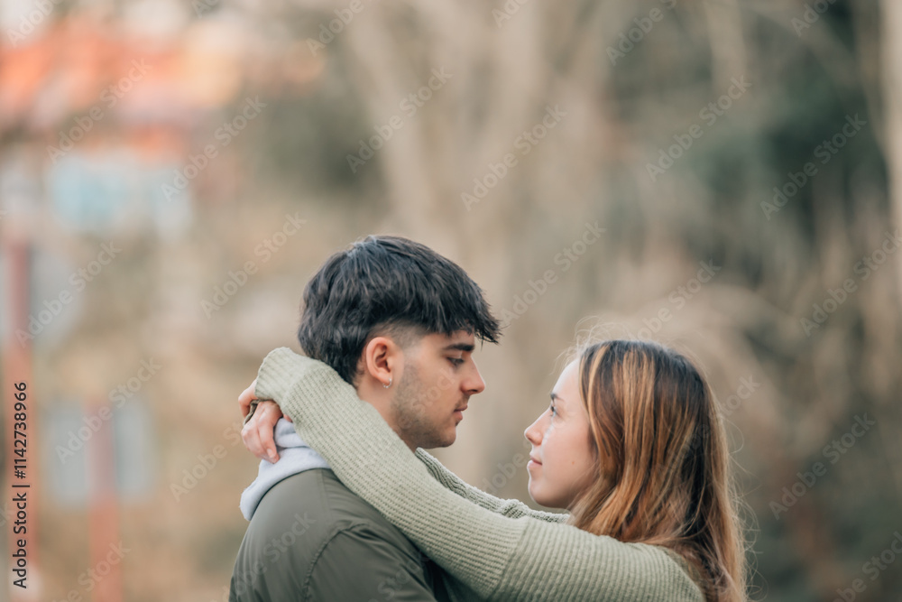 young couple in love hugging on the street young couple in love hugging on the street