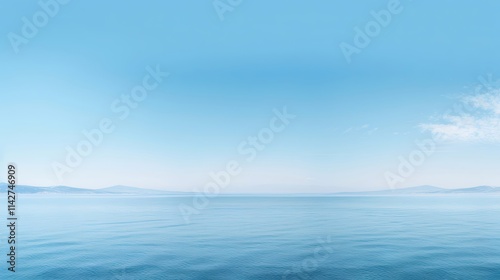 Serene ocean under a clear blue sky.