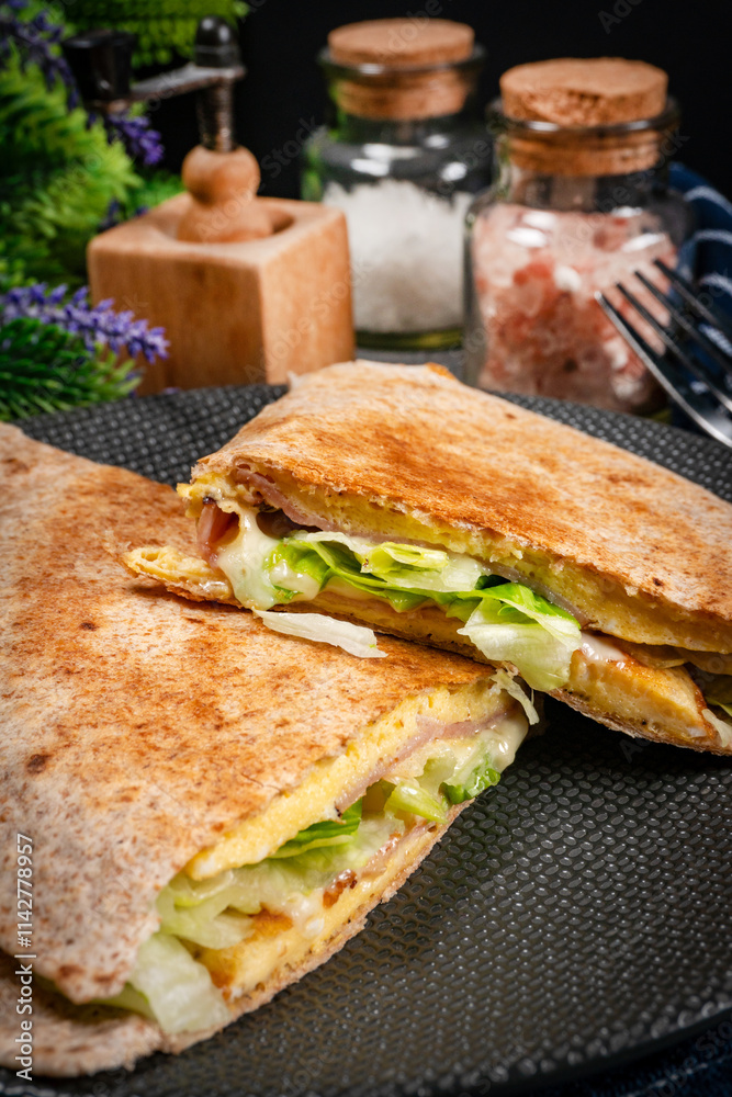 Tortilla multigrain with omelette, lettuce and ham. Tortilla multigrain with omelette, lettuce and ham.