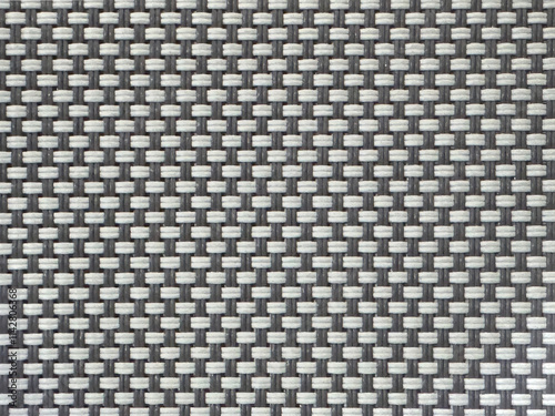 Close up photo of grey and white woven bamboo rattan texture. Wicker art or bamboo rattan weaving grey color in small checkerboard pattern. Seamless background texture.