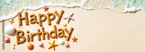 Happy Birthday Text Written in Sand on a Beach with Starfish and Shells