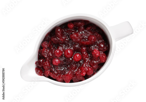 Tasty cranberry sauce in gravy boat isolated on white, top view