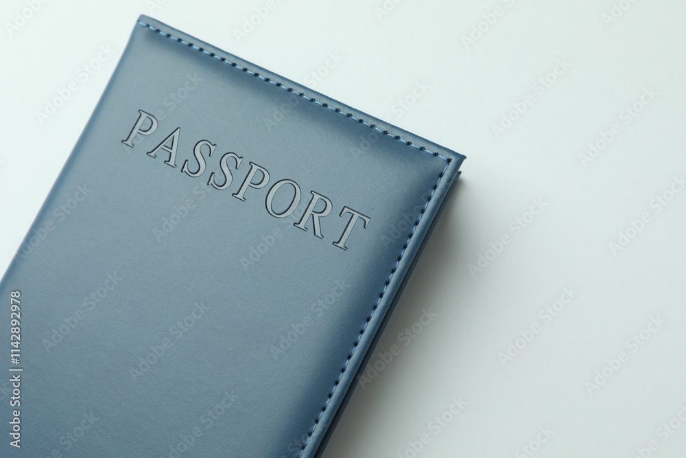 Passport in dark blue cover on light background, top view Passport in dark blue cover on light background, top view