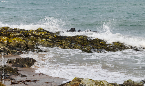 Waves crashing over the rocks at Groomsport Co. Down Northern Ireland