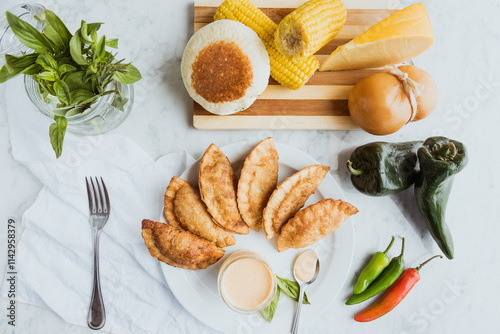 empanadas with garnishes and fresh ingredients