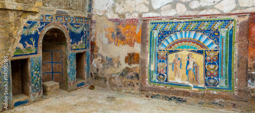 Ruins of reception room in an ancient roman villa with colorful wall mosaics, Herculaneum archaeological site, Ercolano, Campania, Italy