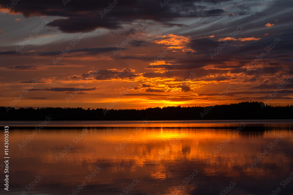 A stunning sunset over a calm lake, with dramatic clouds and warm orange and golden reflections on the water, creating a serene and scenic view. A stunning sunset over a calm lake, with dramatic clouds and warm orange and golden reflections on the water, creating a serene and scenic view.