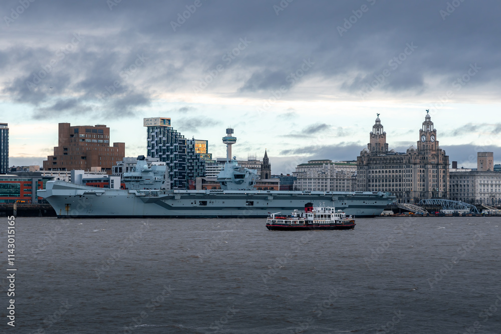 HMS Prince of Wales with Liverpool skyline and Mersey ferry HMS Prince of Wales with Liverpool skyline and Mersey ferry