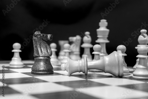 Chessmen photographed on a chessboard with a dark background