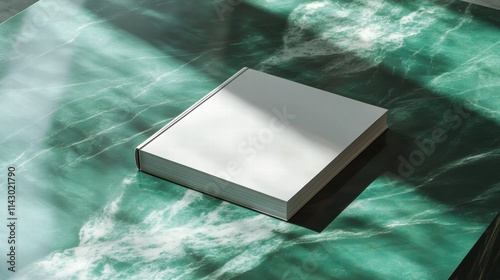 Blank magazine mockup on a green marble stone coffee table with a shadow overlay.