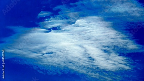 Blue sky and white clouds - composition with natural patterns and texture of clouds. Topics  abstract sky background  air space  climate  atmosphere  meteorology  season  abstraction  nature