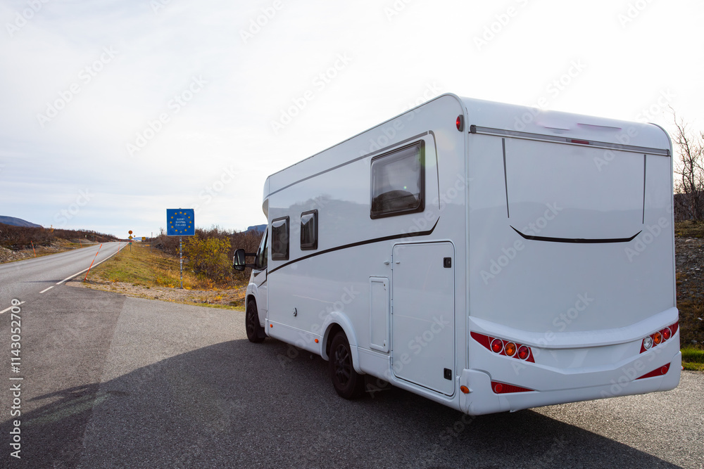 White camper van parked in a serene pine forest, offering a tranquil escape into nature near Finland border White camper van parked in a serene pine forest, offering a tranquil escape into nature near Finland border
