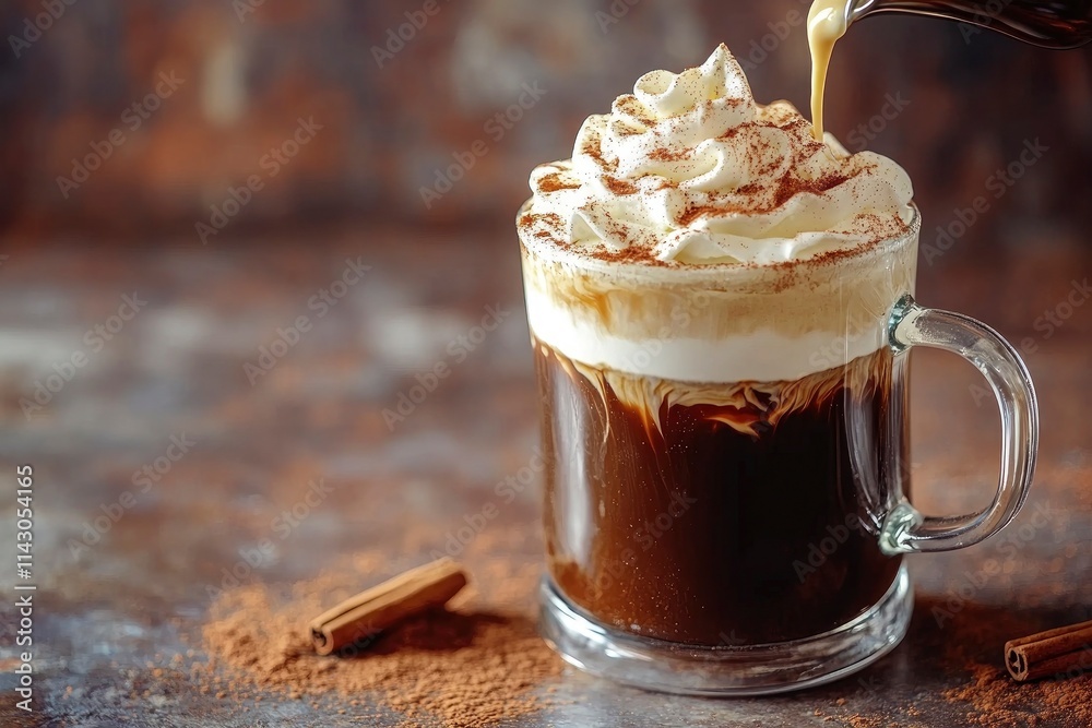 Pouring whipped cream into an Irish coffee with cinnamon on marble and brown background Pouring whipped cream into an Irish coffee with cinnamon on marble and brown background