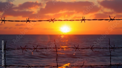 sunset, ocean, barbed wire, peaceful view, nature, serene, horizon, dusk, dramatic sky, barrier, isolation, calm waters, warm colors, twilight, safety, reflections, tranquil landscape, natural beauty photo