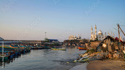 tiny Boats on the sea overlooking Thekkumbhagam Juma Masjid photo