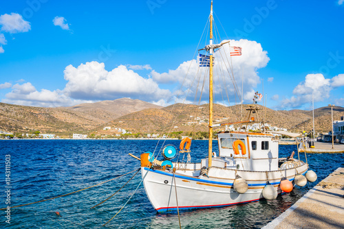 Obraz na płótnie Traditional fishing boat anchoring in small port of Katapola village, Amorgos island, Cyclades, Greece w salonie