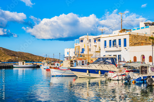 Obraz na płótnie Boats anchoring in Katapola port with white houses on shore, Amorgos island, Cyclades, Greece w salonie