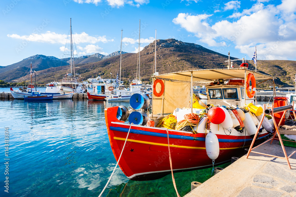 Colorful fishing boats anchoring in Katapola port with mountains in background, Amorgos island, Cyclades, Greece